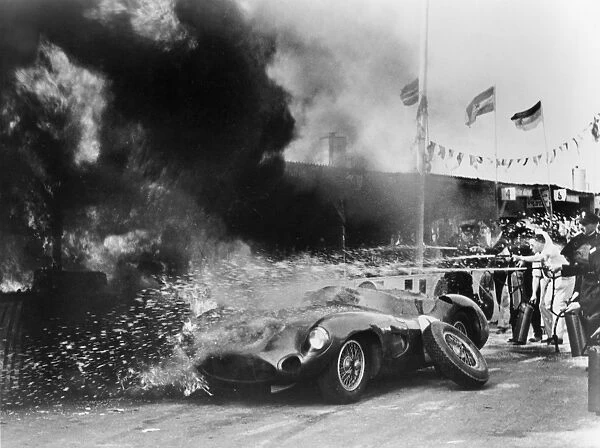 Aston Martin DBR1 on fire in pits during 1959 TT at Goodwood, Moss-Salvadori drivers