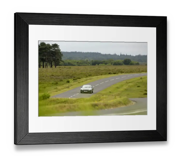 Framed Print : 2005 Aston Martin DB9 on winding country road