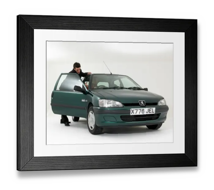 Framed Print : Car salesman showing customer around used car