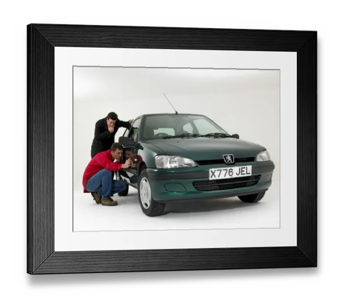 Framed Print : Car salesman with customer checking bodywork