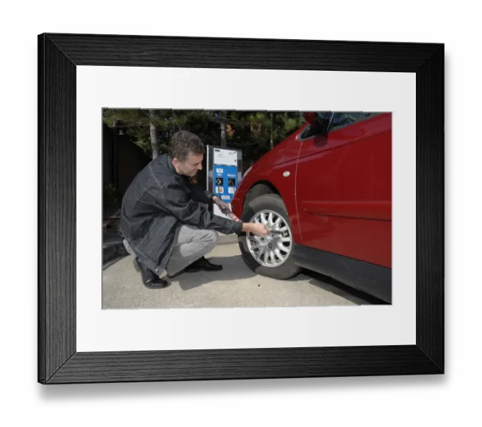 Framed Print : Man inflating car