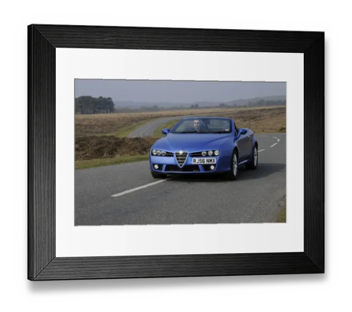 Framed Print : 2006 Alfa Romeo Spyder driving in New Forest