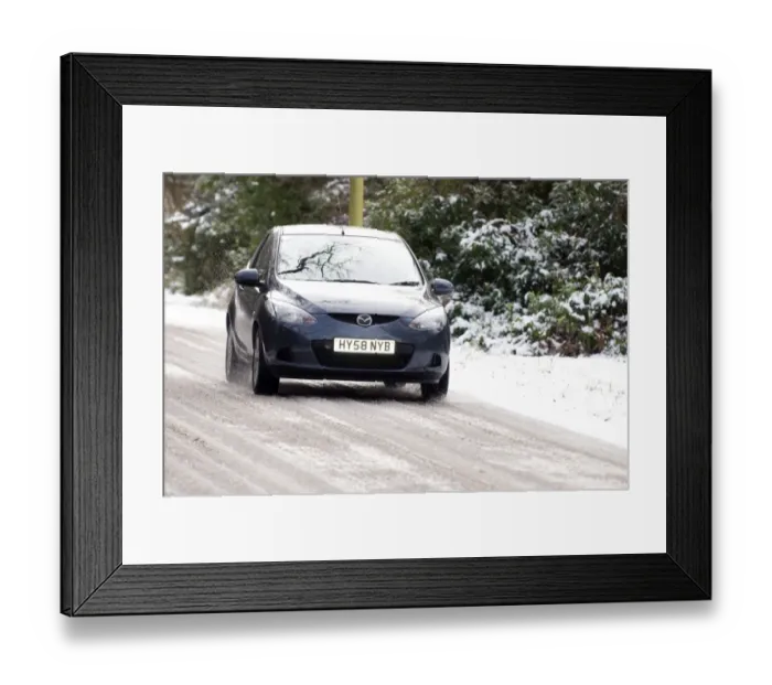 Framed Print : 2009 Mazda 2 driving Framed Print : 2009 Mazda 2 driving