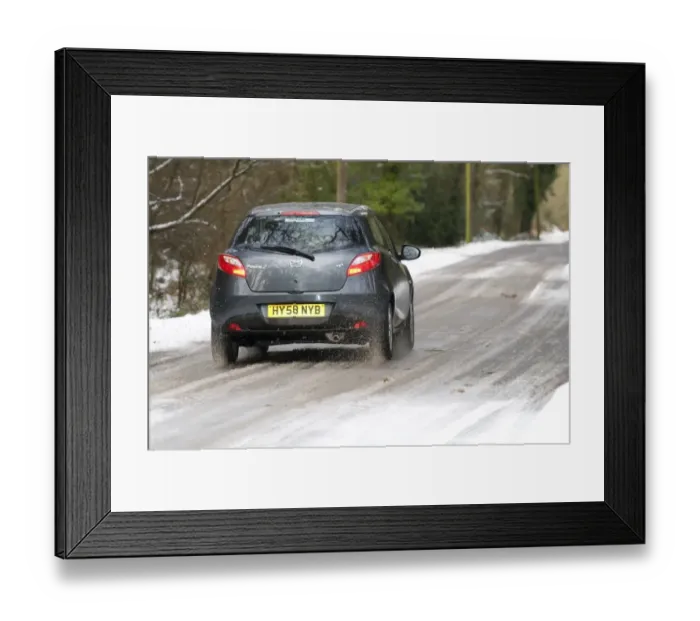 Framed Print : 2009 Mazda 2 driving Framed Print : 2009 Mazda 2 driving