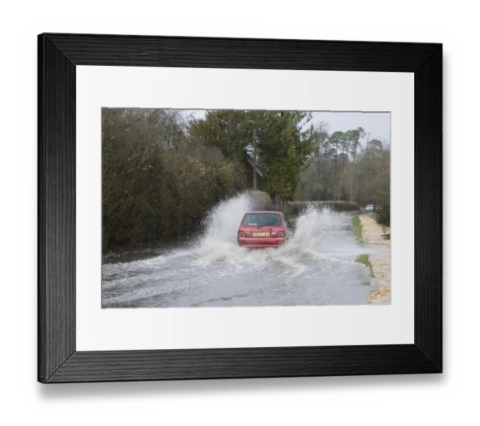 Framed Print : Car driving through flood Framed Print : Car driving through flood