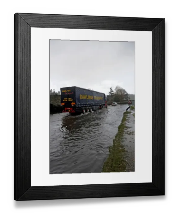 Framed Print : Articulated Lorry driving on flooded road Framed Print : Articulated Lorry driving on flooded road