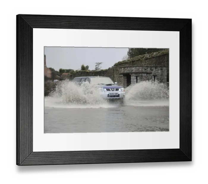 Framed Print : Car driving through flood Framed Print : Car driving through flood