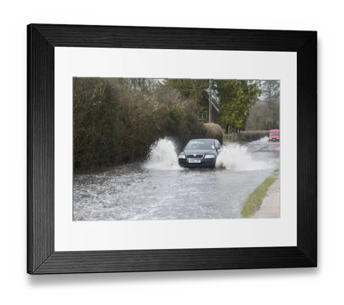 Framed Print : Car driving through flood