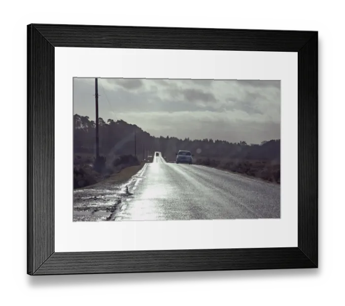 Framed Print : Driving on country road against the low winter sunshine Framed Print : Driving on country road against the low winter sunshine