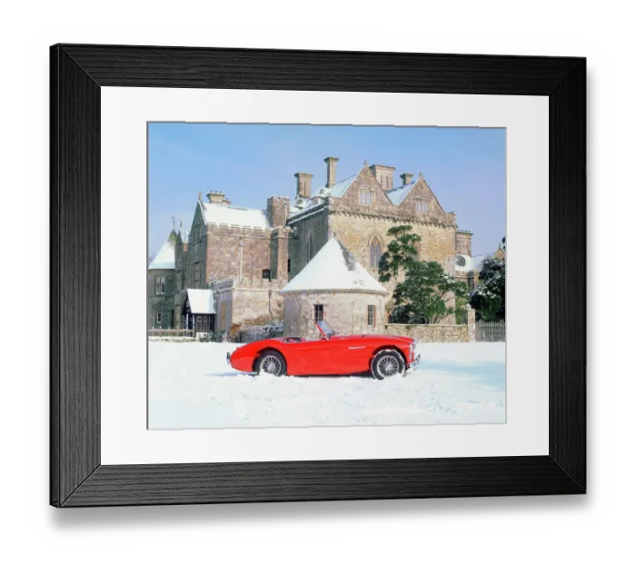 Framed Print : Austin Healey 100 in snow in front of Palace House Framed Print : Austin Healey 100 in snow in front of Palace House