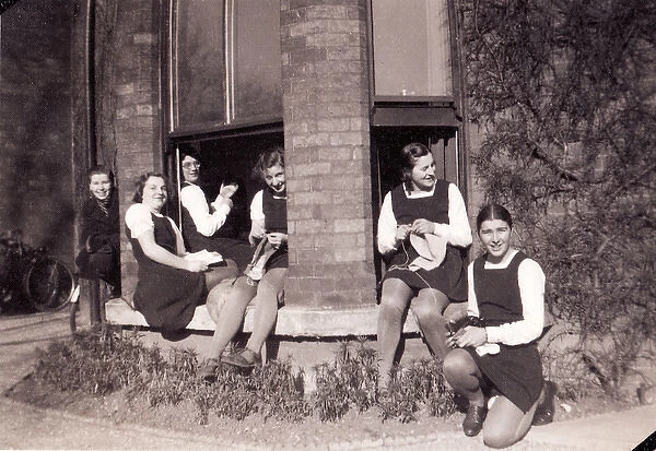 Group sitting at open bay window