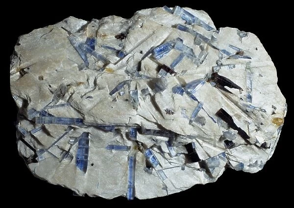 Kyanite comprises of (aluminum silicate) and shares this composition with both sillimanite