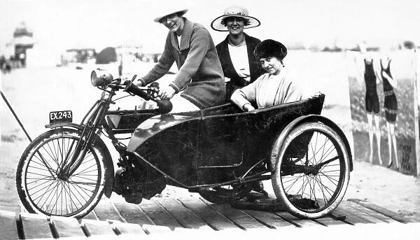 Ladies on a veteran 1910 motorcycle & sidecar