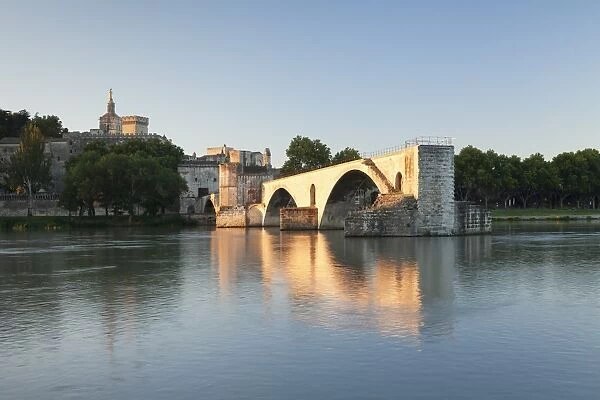 Bridge St. Benezet over Rhone River with Notre Dame des Doms Cathedral and Papal Palace at sunrise