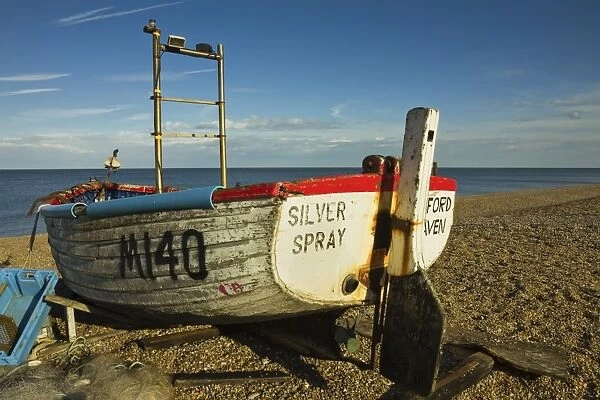 Fishing boat and nets on the seafront shingle beach of this popular unspoiled seaside town, Aldeburgh, Suffolk, England, United Kingdom, Europe