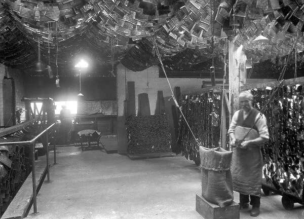 Coxs Gelatine and Glue Factory, Gorgie Road, Edinburgh (view of man bagging gelatine sheets)