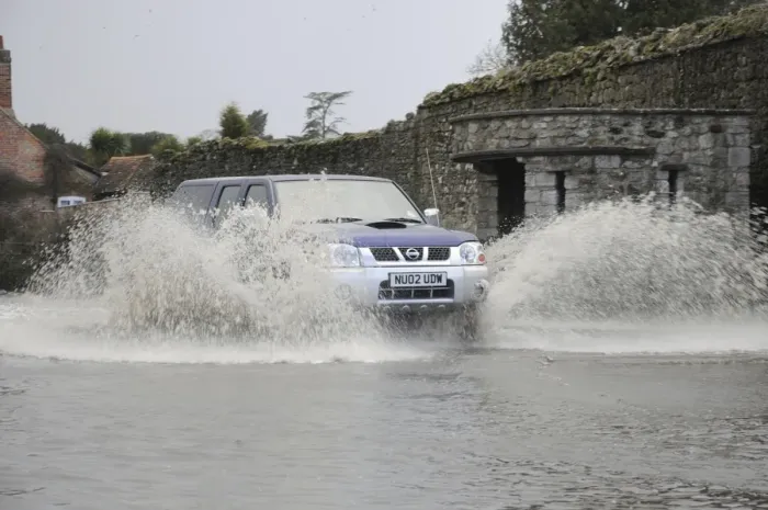 Framed Print : Car driving through flood Framed Print : Car driving through flood