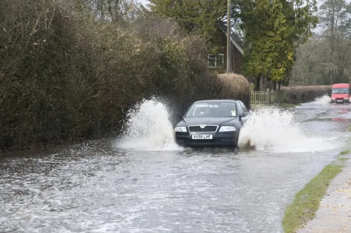 Framed Print : Car driving through flood