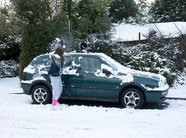 Girls palying with snowballs by VW Golf 2009