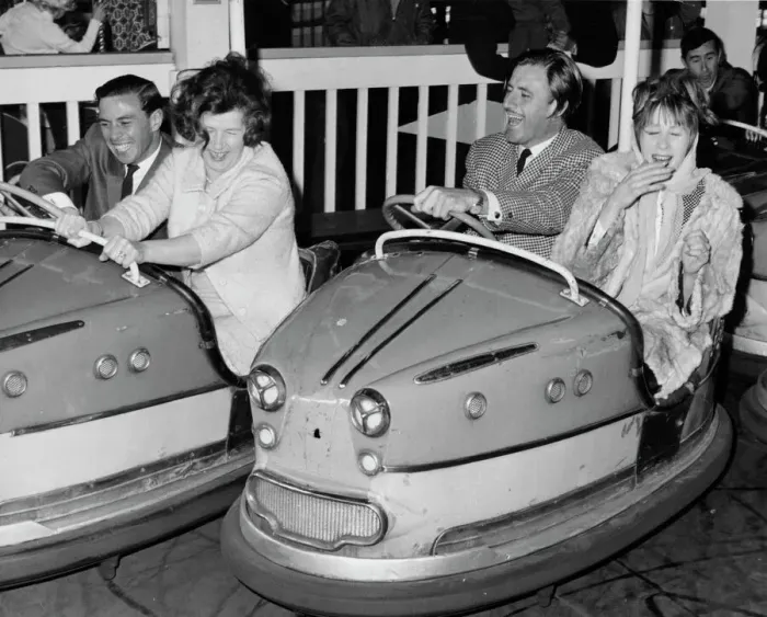 Framed Print : Racing drivers Graham Hill and Jim Clark enjoying a dodgem ride