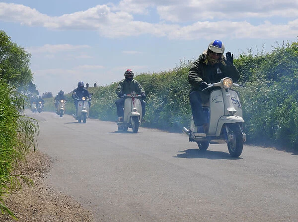 Scooters on a run through British countryside