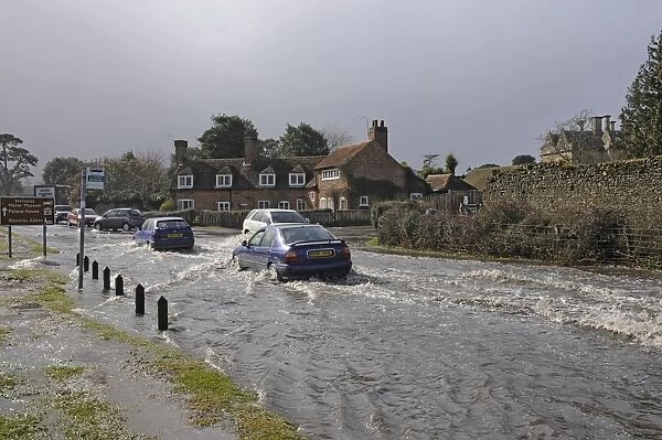 Traffic driving through Flood Water