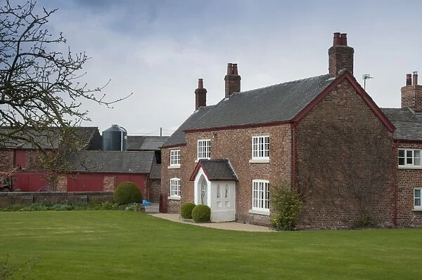 Red brick farmhouse, Cheshire, England, april