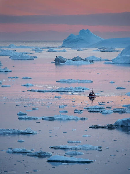 Boat at Ilulissat Icefjord, a UNESCO World Heritage Site, also called kangia or Ilulissat