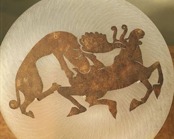 Ornament depicting a tiger tearing a moose