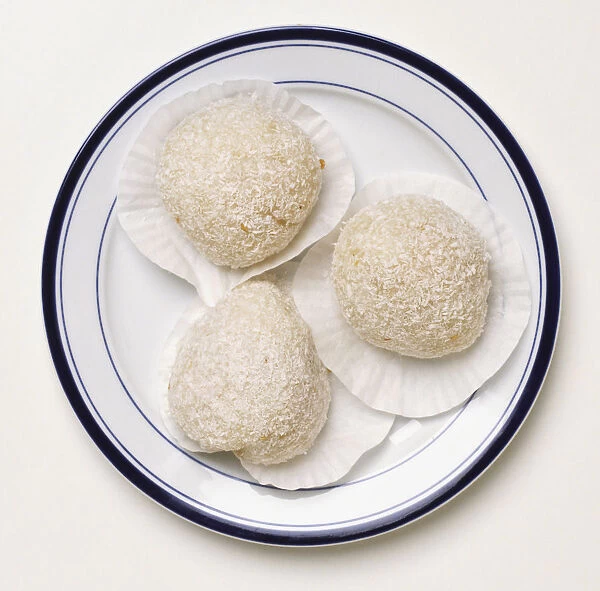 Three sticky rice scoops on a plate