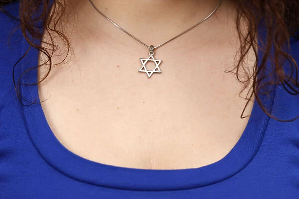 Young woman with a star of David necklace