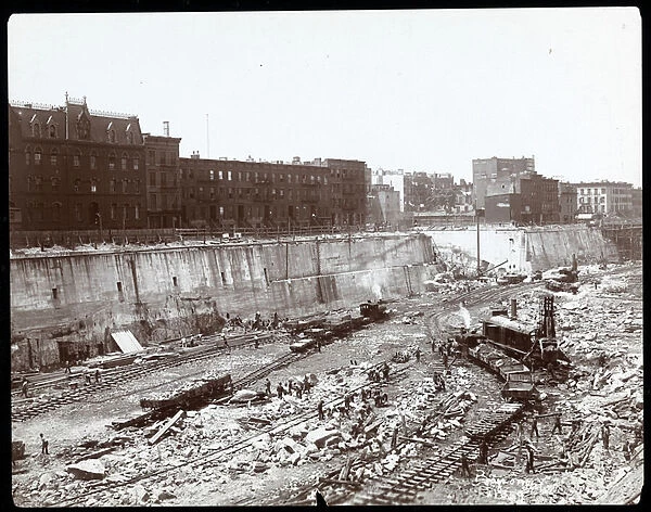 View of workers in the huge excavation for Pennsylvania Station, New York