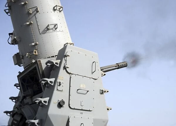 A close-in weapons system fires during an operational test aboard USS Vicksburg