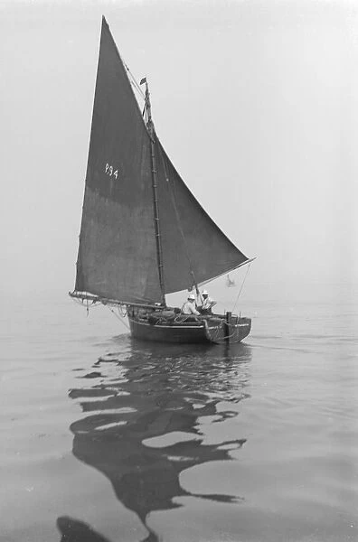 Fishing Smack under sail, 1911. Creator: Kirk & Sons of Cowes