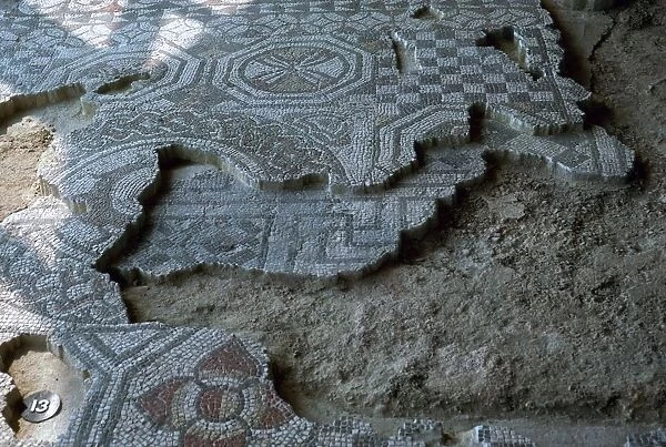 Medusa-head mosaic laid over an earlier mosaic, 3rd century