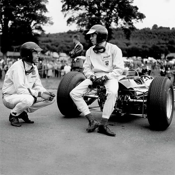 1964 Belgian Grand Prix - Dan Gurney and Jim Clark: Jim Clark talks to Dan Gurney