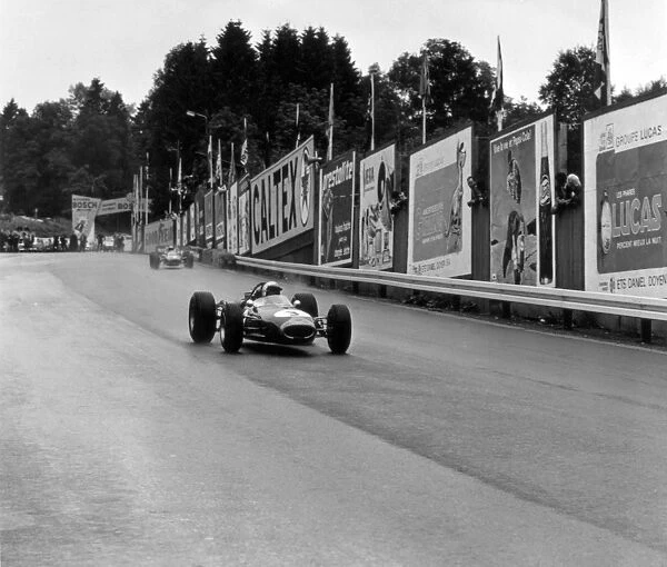 1966 Belgian Grand Prix: Jack Brabham, Brabham BT19-Repco, 4th position, leads Lorenzo Bandini, Ferrari 158  /  246, 3rd position, action