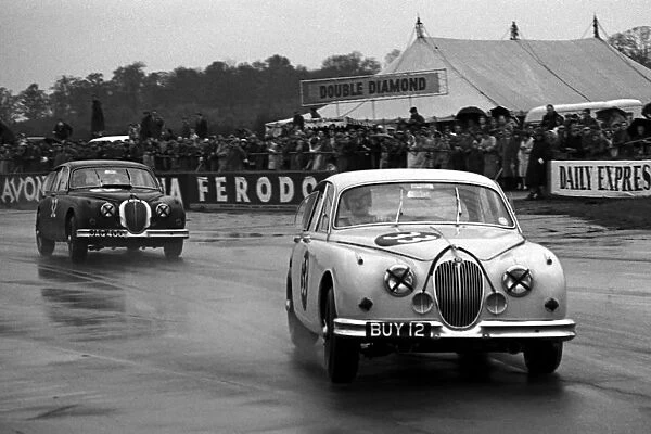 British Saloon Car Racing: Jaguar Mk2├òs race in the wet: British Saloon Car Racing, Silverstone, England, July 1962