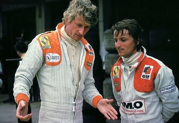 Formula One World Championship: Tenth placed Jean-Pierre Jabouille talks with his Renault team mate Rene Arnoux, who spun out of the race on lap 29