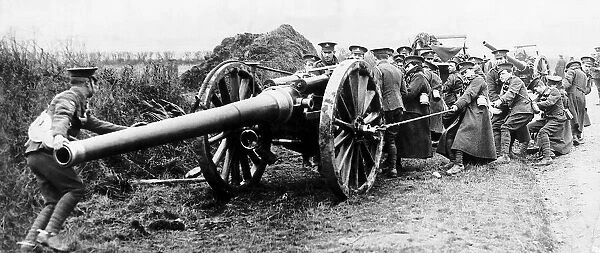 British gunners struggle to pull a 60 pounder field gun into position during World War