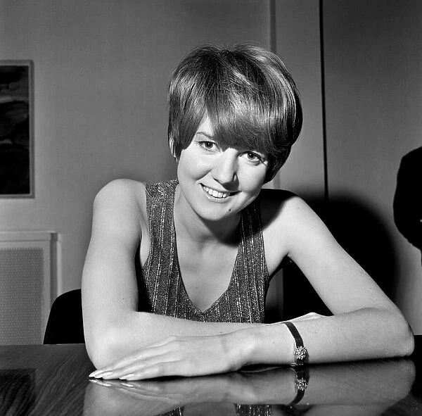 Cilla Black relaxes between shots at the filming of The Beatles spectacular at Granda TV