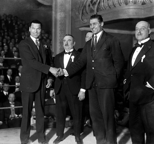 Jack Dempsey at the national Sporting Club shakes hands with Phil Scott