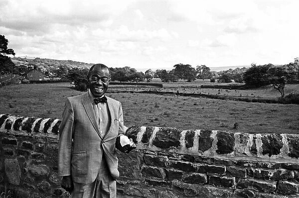Jazz musician Louis Armstrong seen here in the Yorkshire countryside whilst visiting