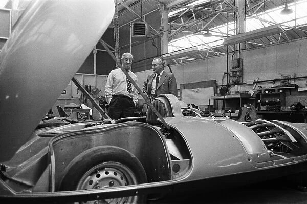 Men, including Syd Enever and Tommy Wisdom looking at the MG EX181 which is being worked