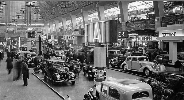 The Motor Show, 1935, at Olympia London. Centre is the Fiat stand