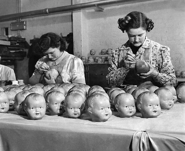 Outstanding workers painting the eyes in 900 dolls a day between them