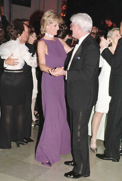 Princess Diana dances with American chat show host Phil Donahue at a charity gala dinner