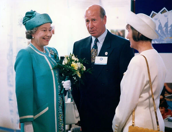 Queen Elizabeth II visits Manchester. The Queen meets Bobby Charlton