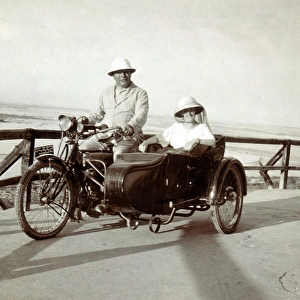 Gentleman & lady on their 1910 Triumph motorcycle & sidecar