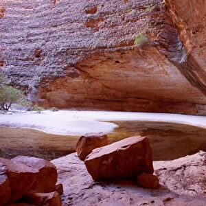 Amphitheatre - striking amphitheatre in Cathedral Gorge which is nestled within the famous beehive-shaped domes of the Bungle Bungles. High red sandstone walls rise up around a waterhole which still has some water in it